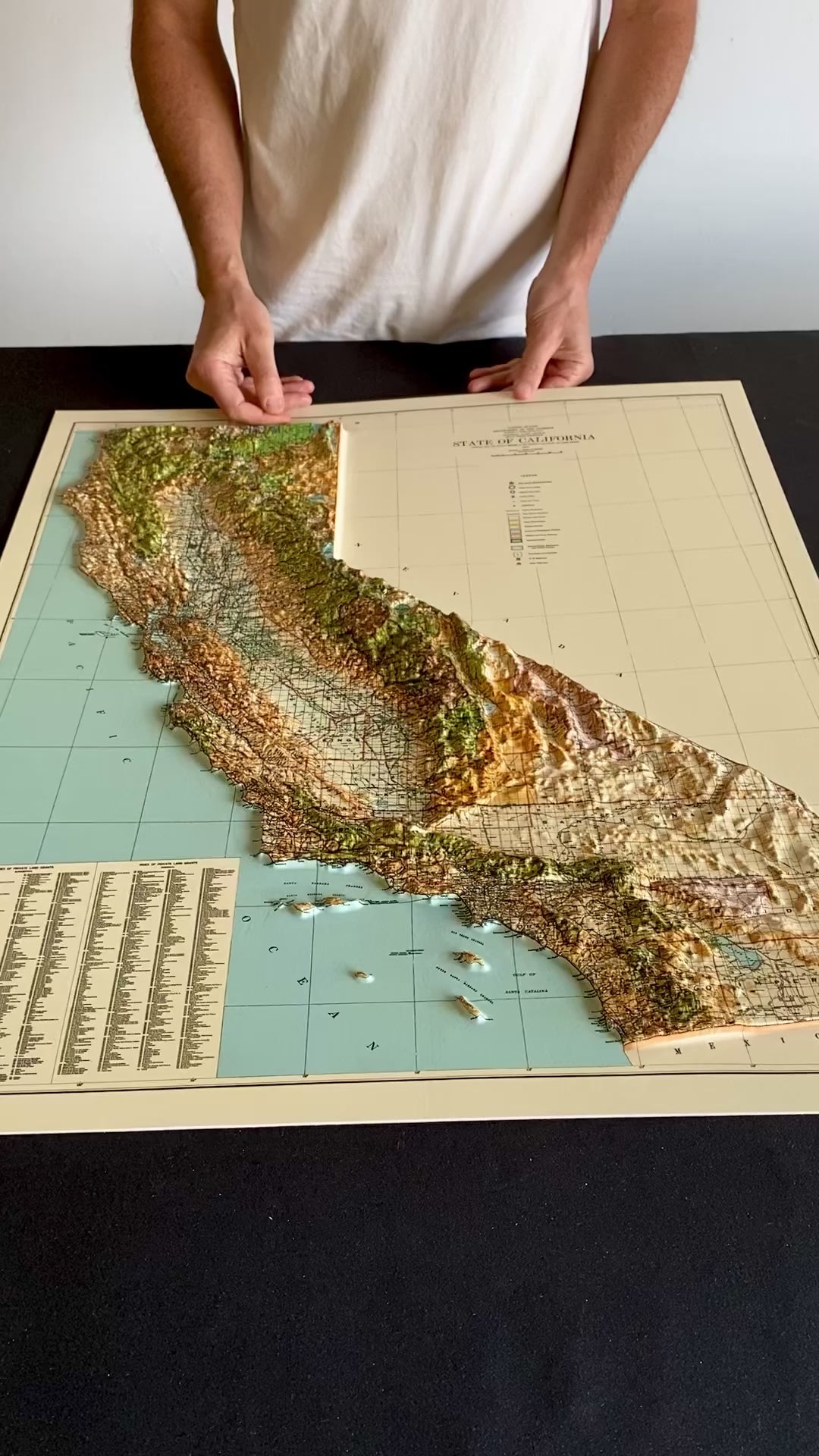Close-up showing a 3D raised relief map of California.